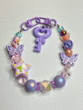 K236 Key to the Cosmos Pastel Butterfly Bag Charm Keychain